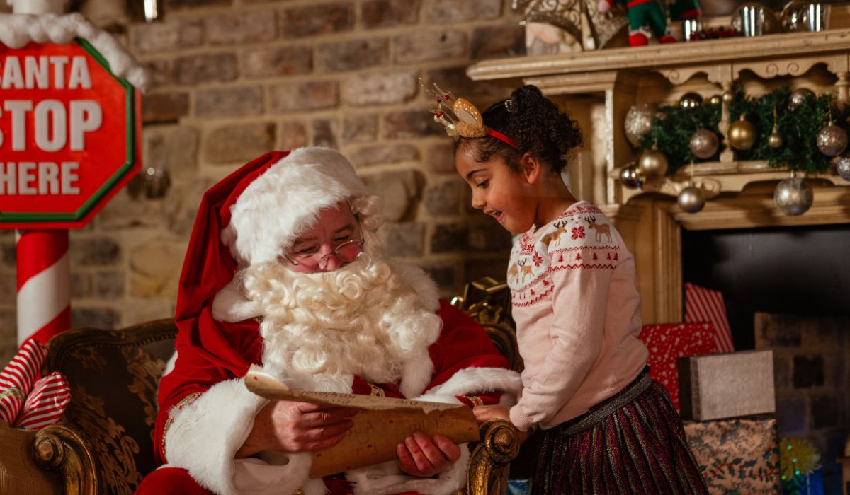 Little girl visiting Santa's grotto