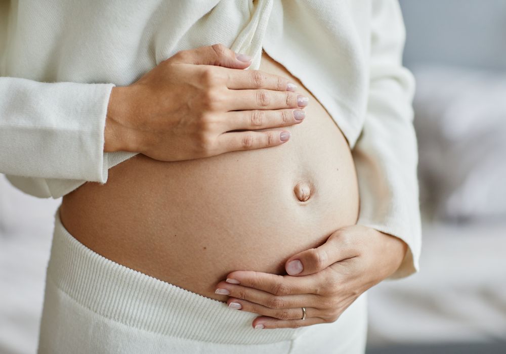 Pregnant woman holding baby bump