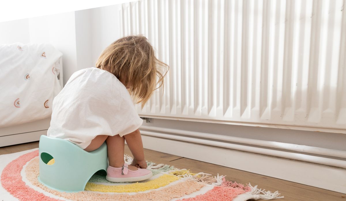 young girl sitting on the potty