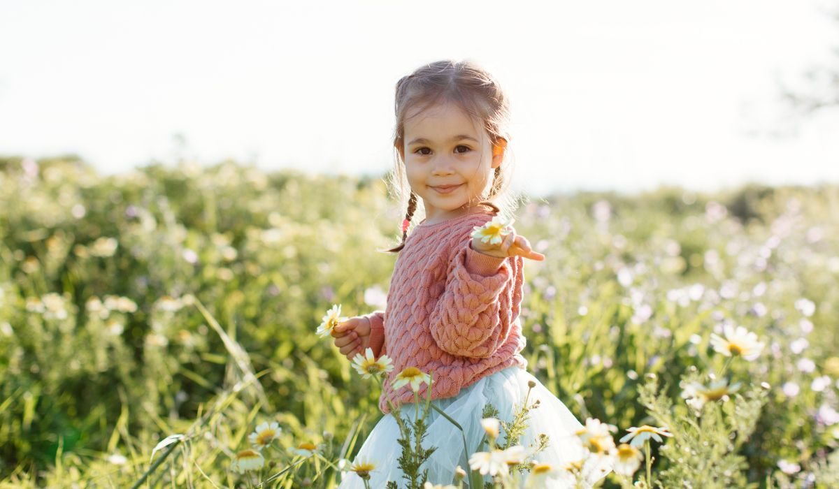 Young girl in a field of flowers