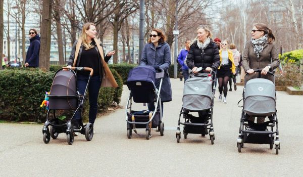 Group of mums taking their babies for a walk