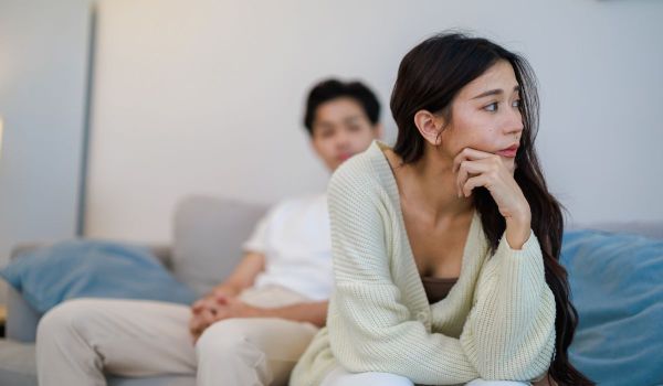 Husband a wife on the couch not talking