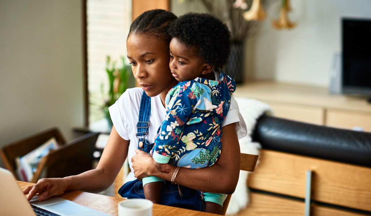 Mother working with her baby