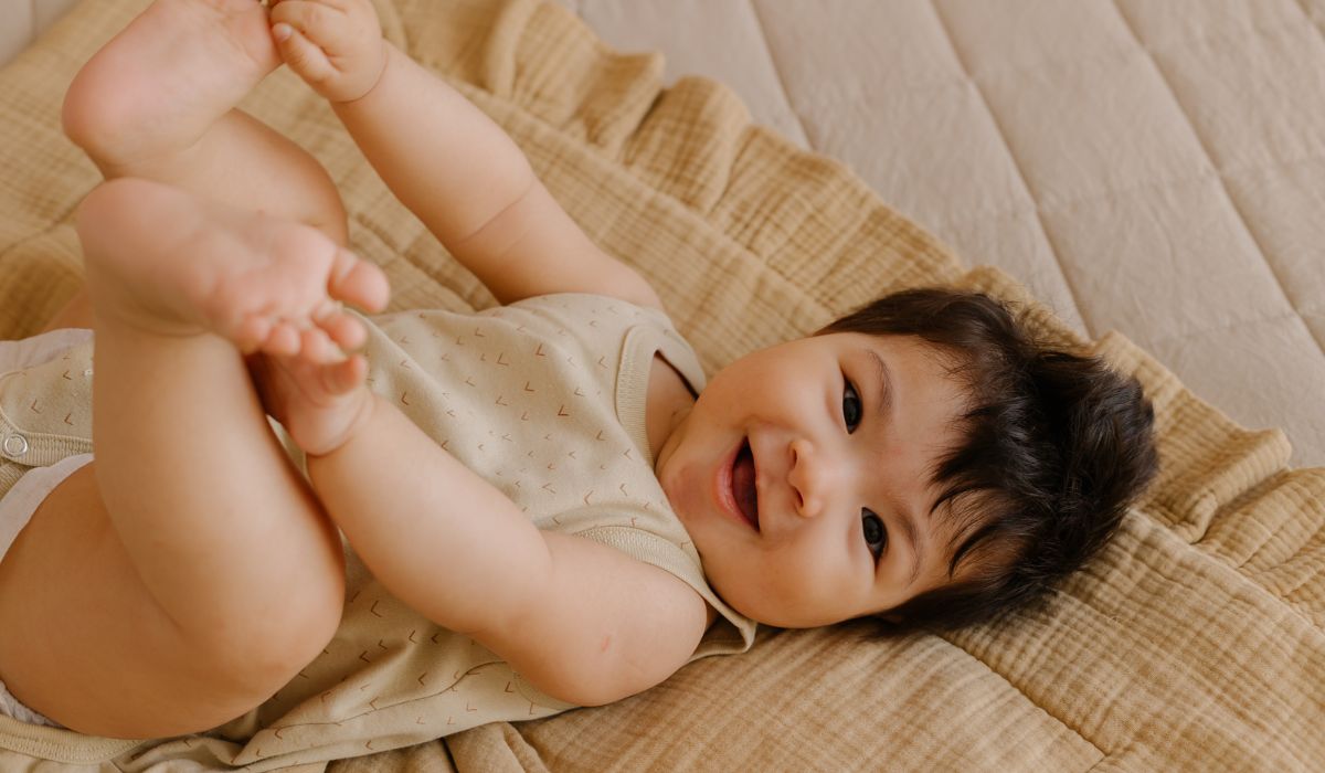 Baby lying on a mat
