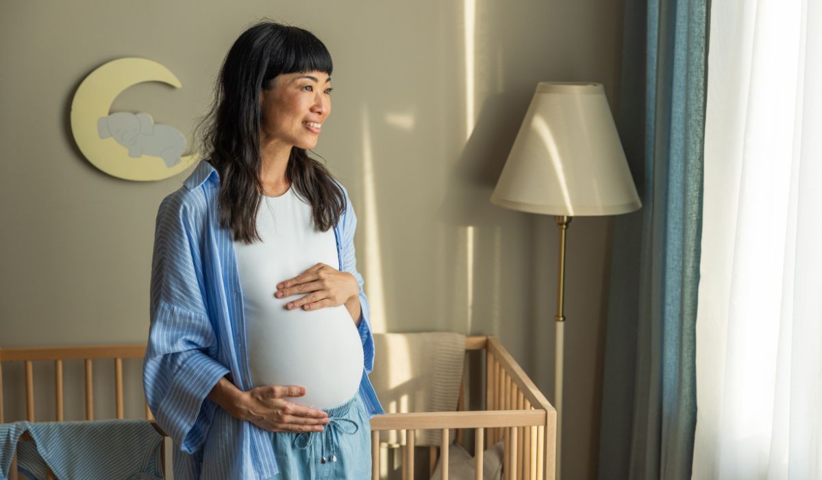 Pregnant woman in a nursery
