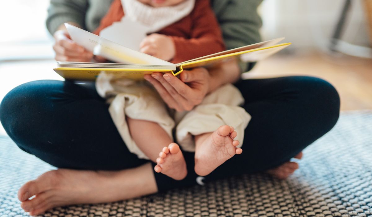 Mum reading to her baby