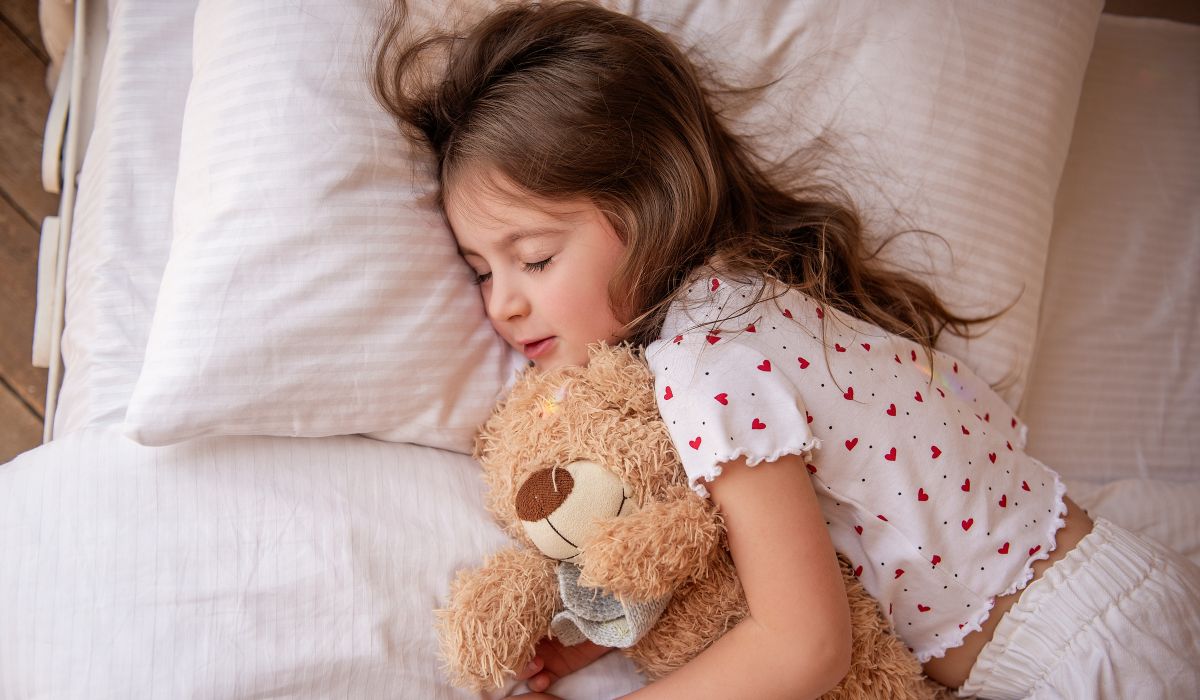 Girl asleep in bed