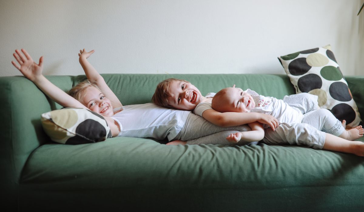 Three babies on couch