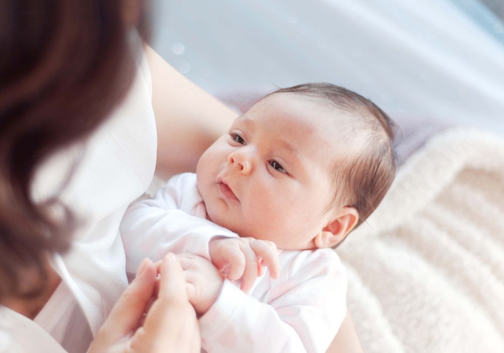 Mother holding new baby