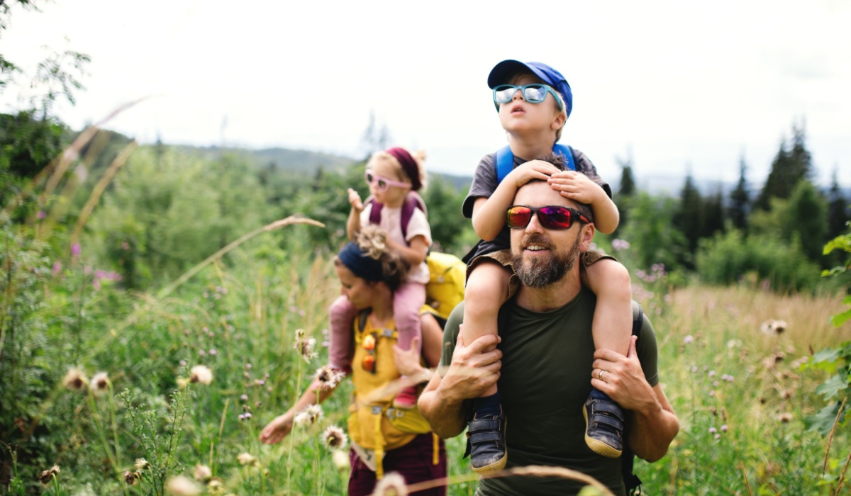 Parents hiking with their kids.