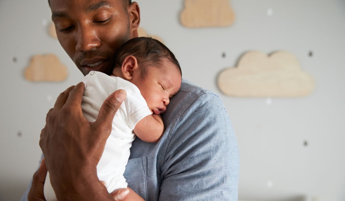 Father holding newborn baby
