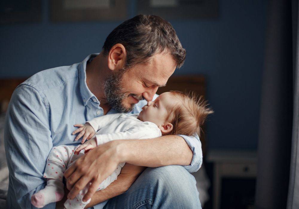Father holding baby