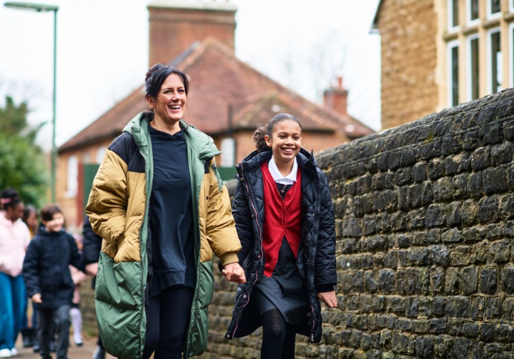 Mother walking child to school