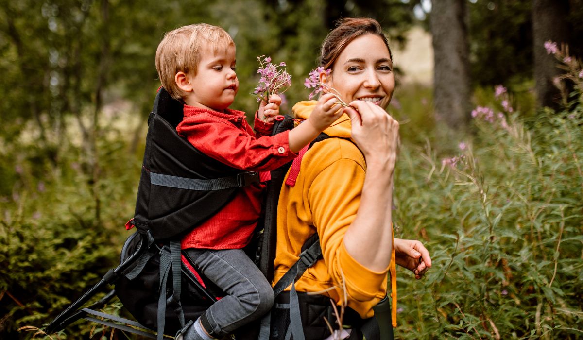 Mum carrying child on her back