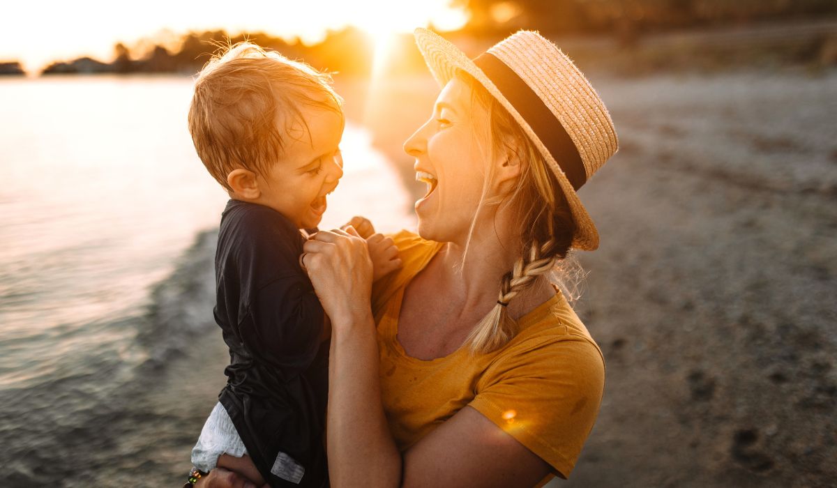 Mum with her son on the beach at night