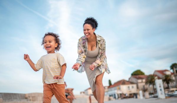 Mum running after her toddler