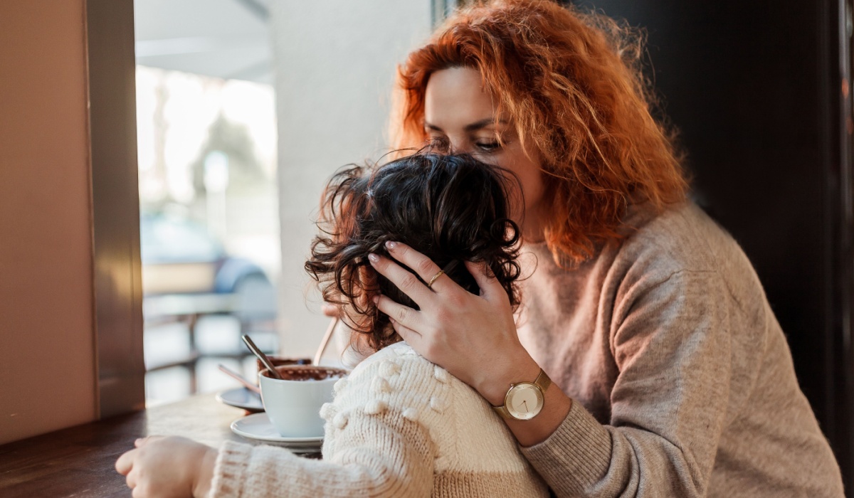 Mother and daughter in coffee shop.
