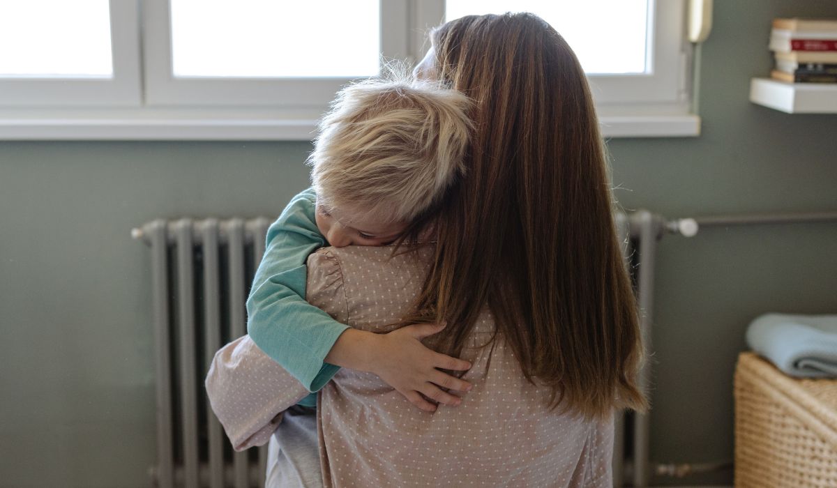 Mum hugging toddler