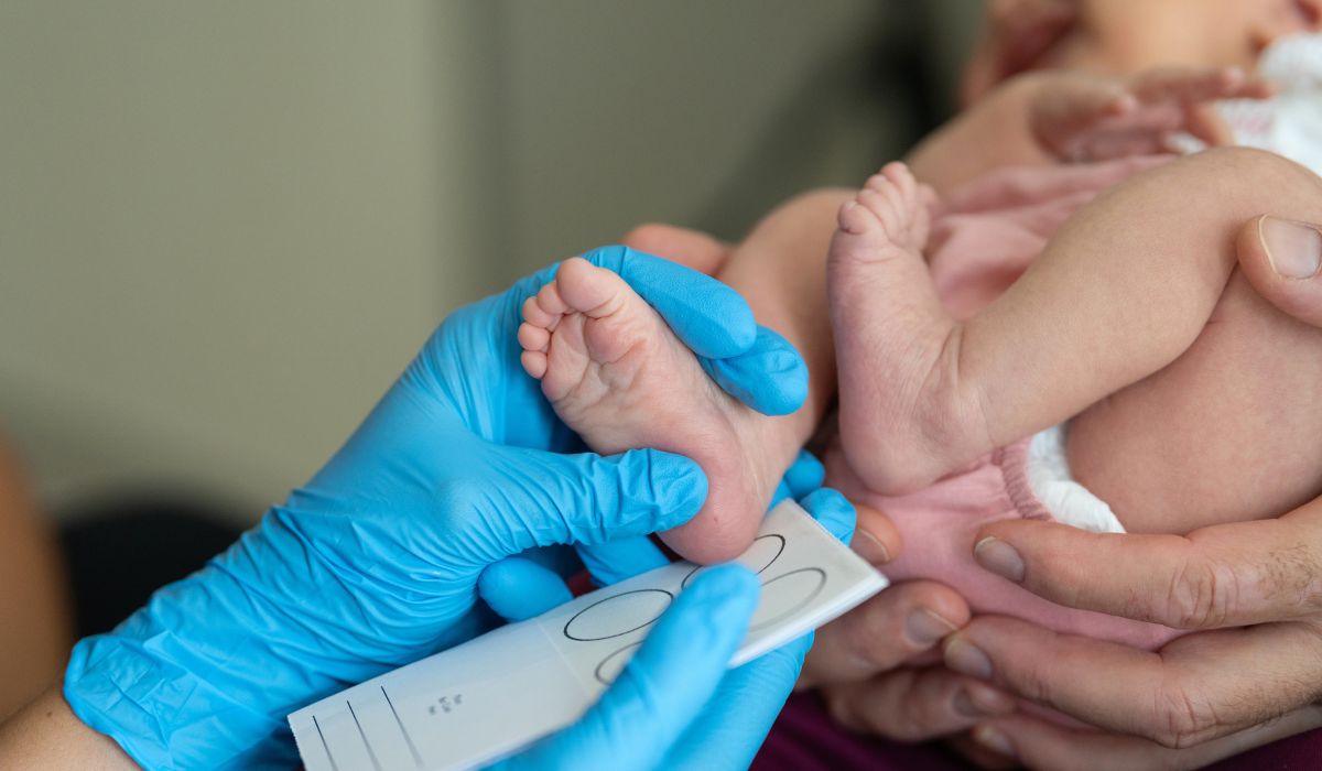 Baby being checked by doctor