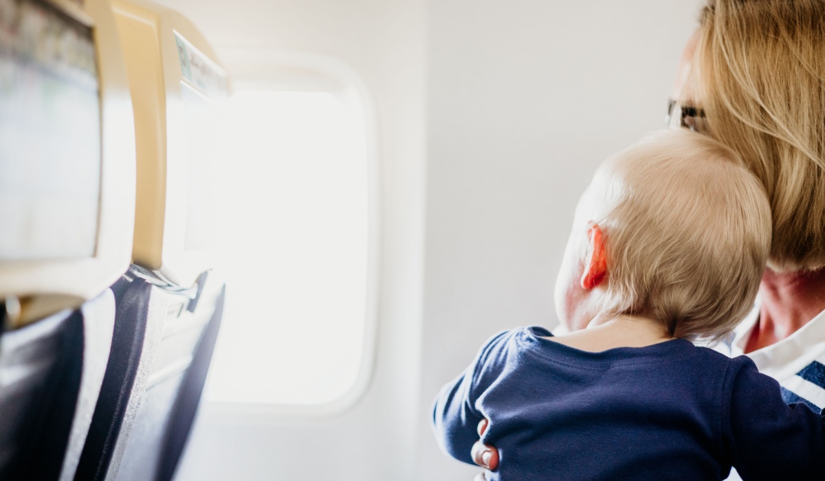 Mother flying with baby