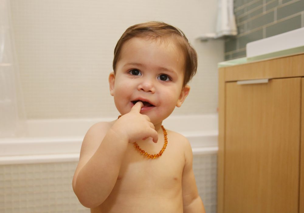 Baby wearing teething necklace