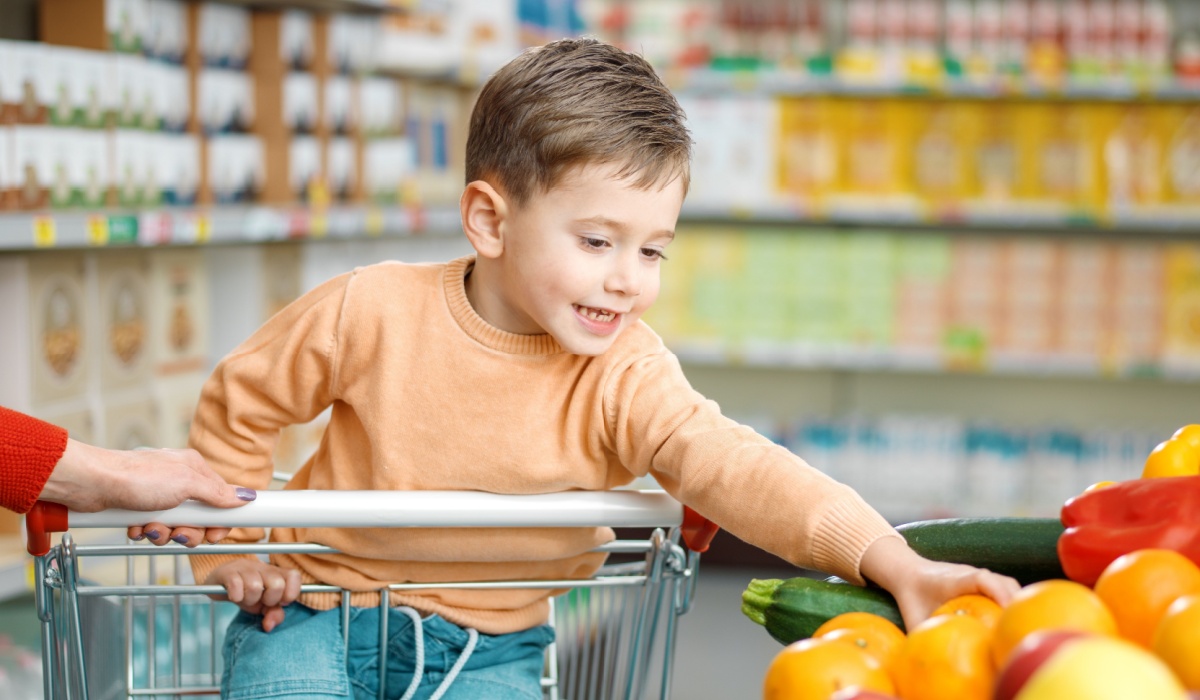 Toddler in grocery store cart