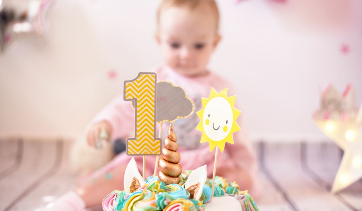 Baby with birthday cake