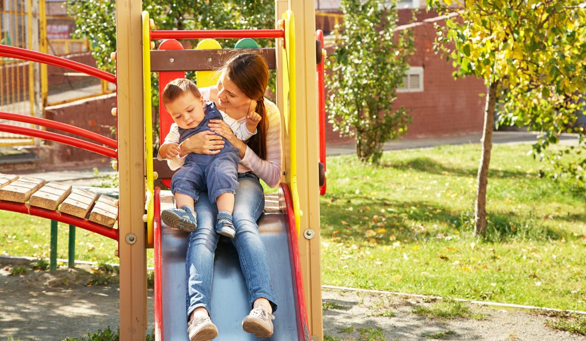 Mother and child on slide