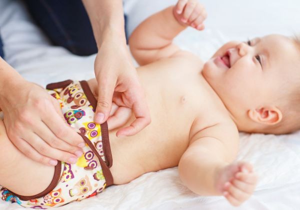 Baby wearing cloth nappy