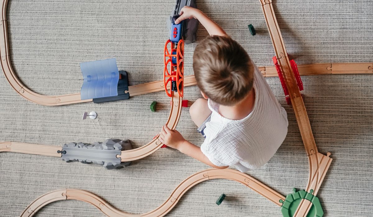 Boy playing with train