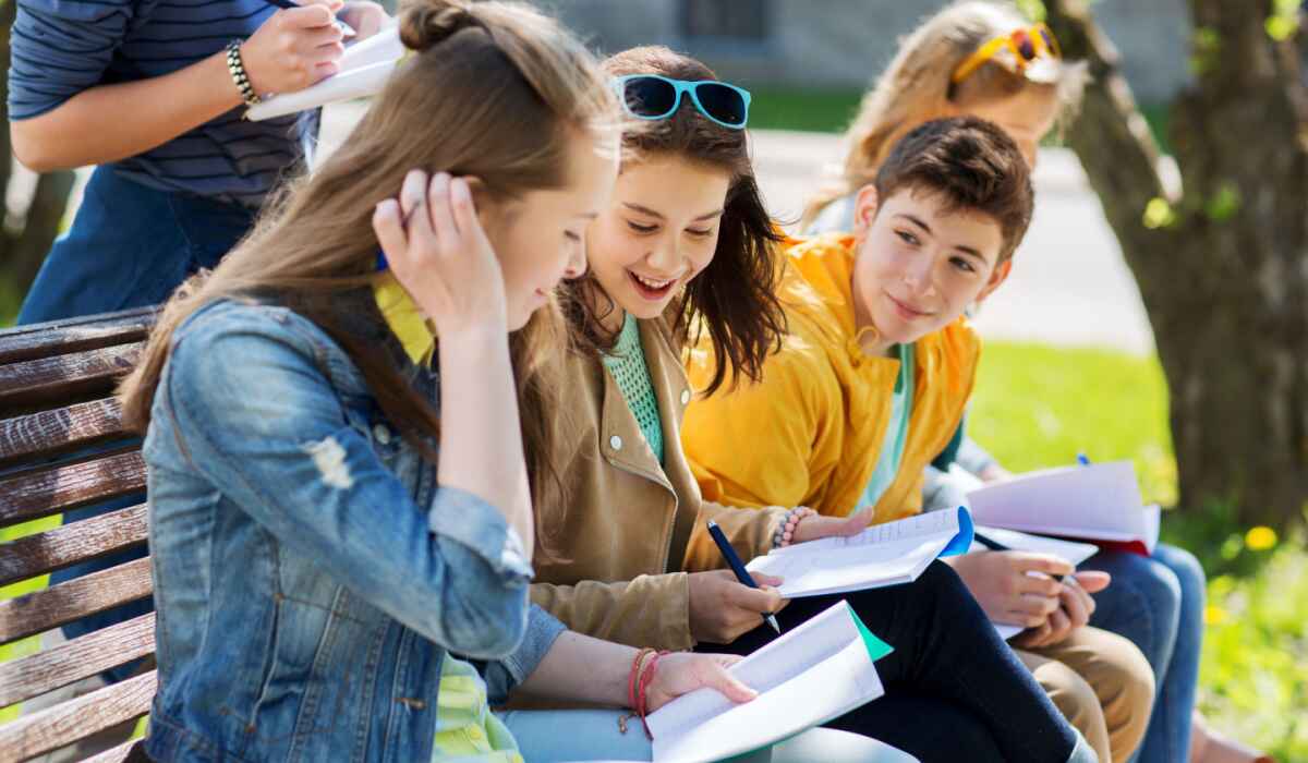Teenagers talking and laughing outside