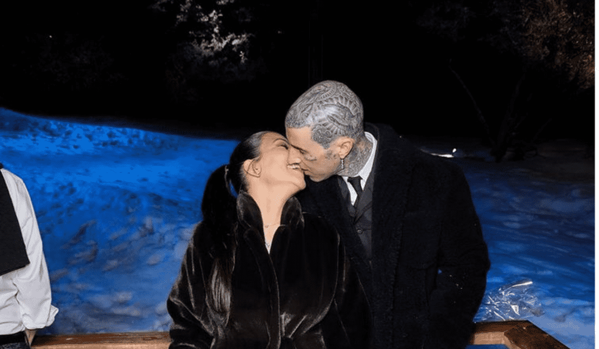 Kourtney Kardashian and Travis Barker kissing