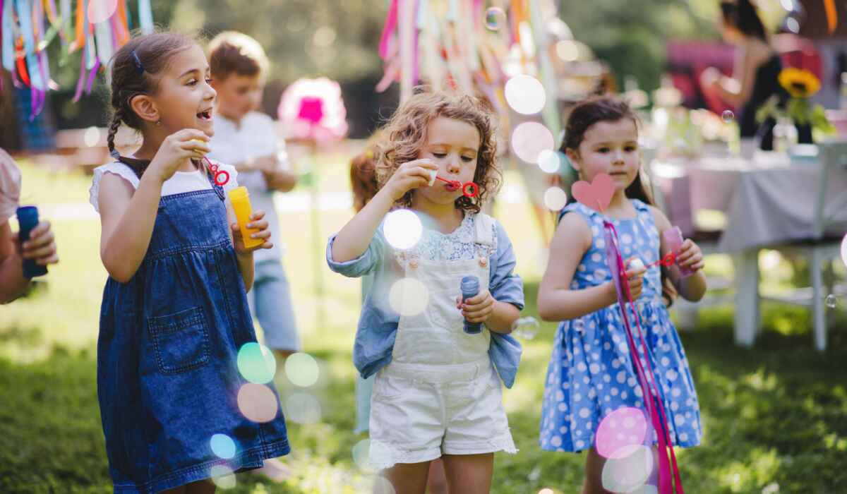 Children playing outdoors for kids party