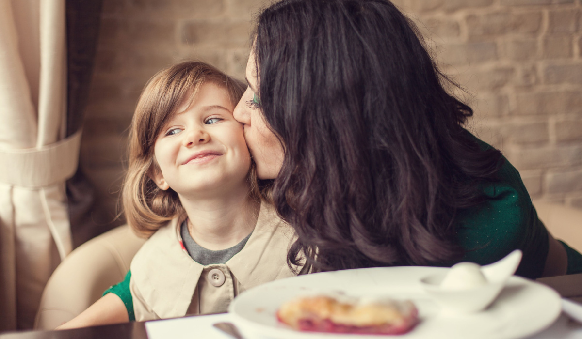 Mother and daughter eating dinner