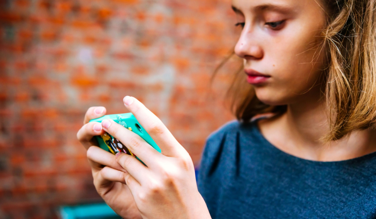 Teen girl looking at her phone