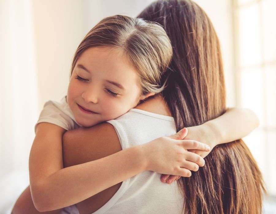 Mother and daughter hug