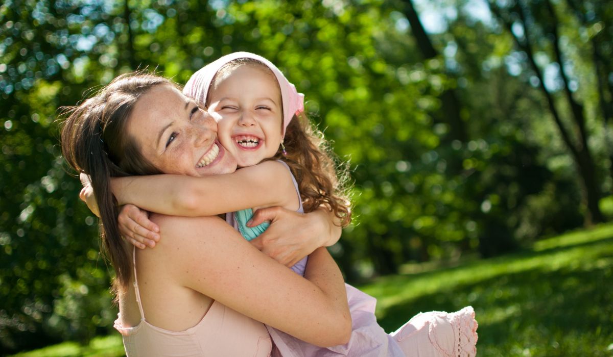 Mother and little girl hug