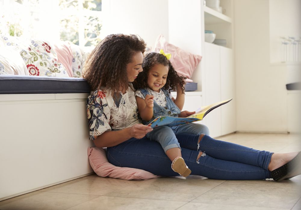 Mother reading to little girl