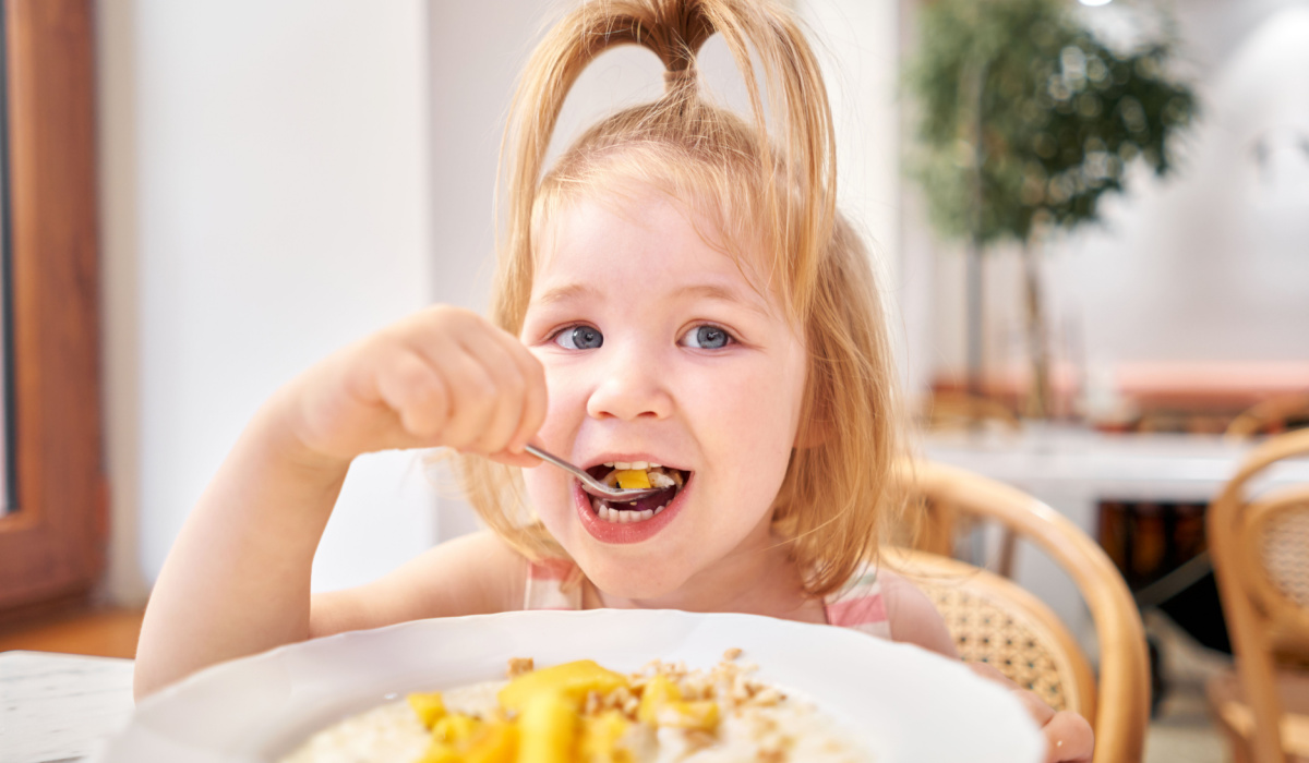 Toddler eating in cafe