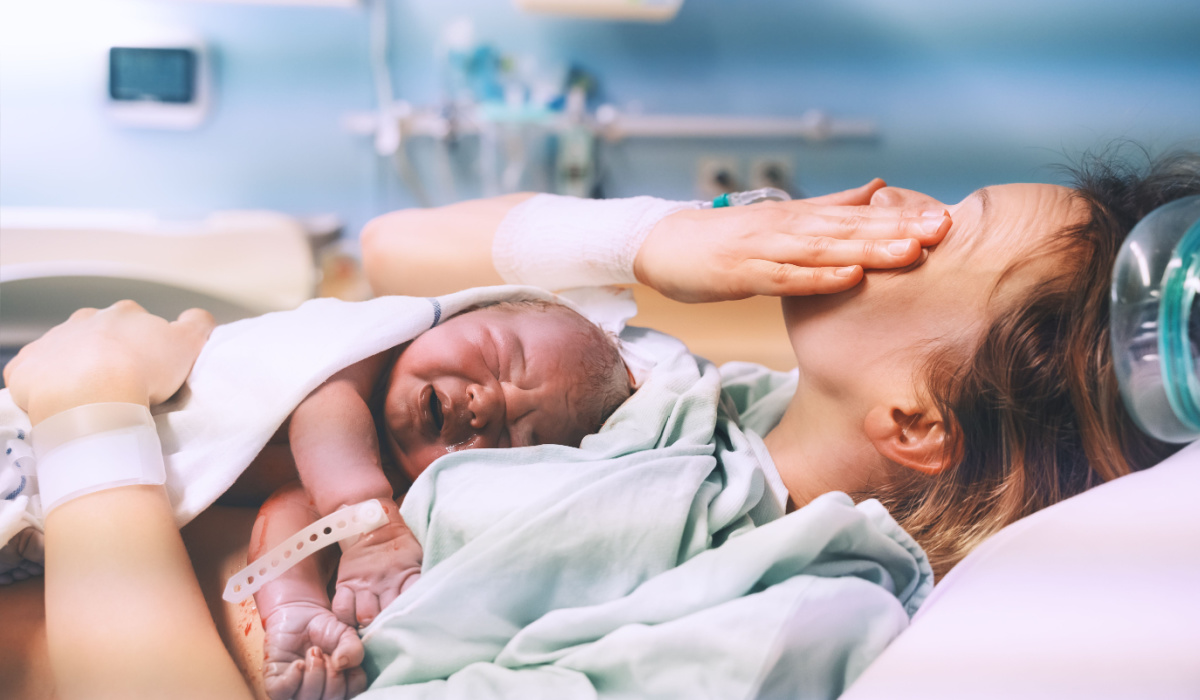 Woman and infant pictured in hospital delivery room