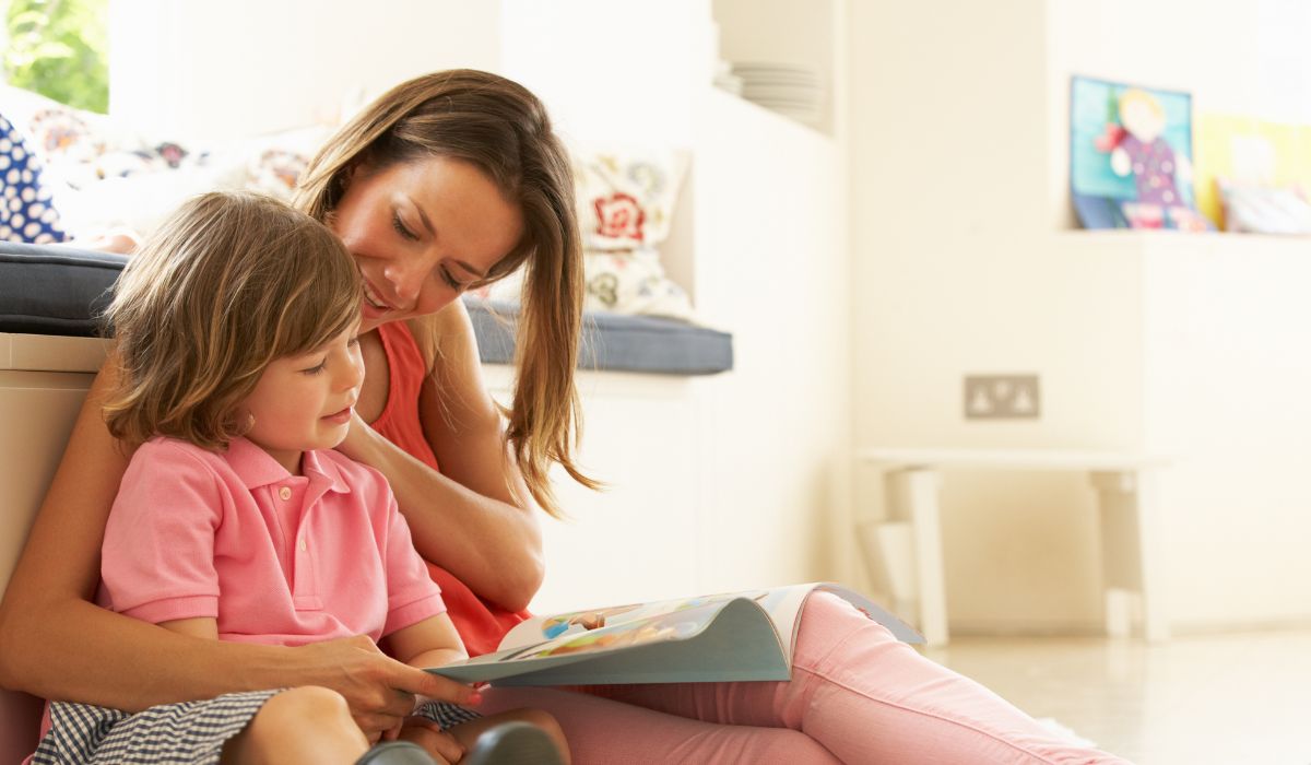 Woman and little boy reading together