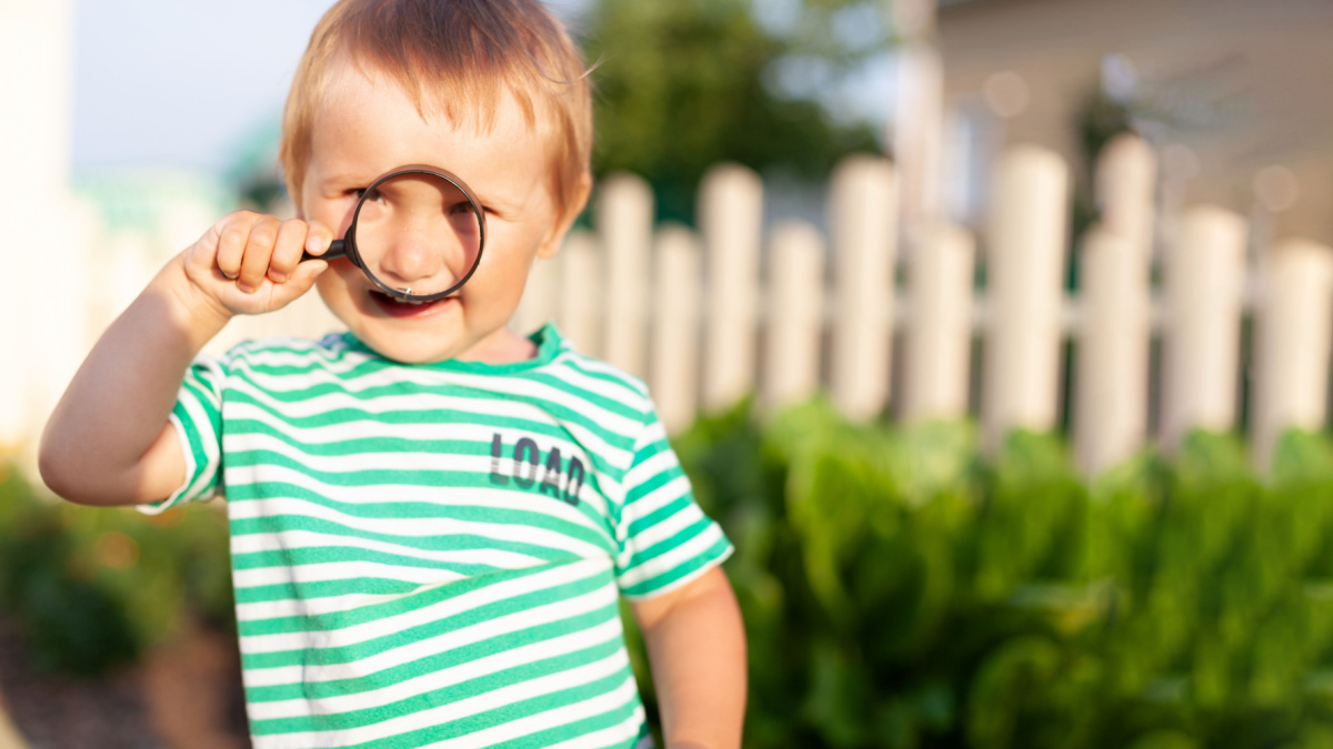 Toddler boy dressed in green t-shirt