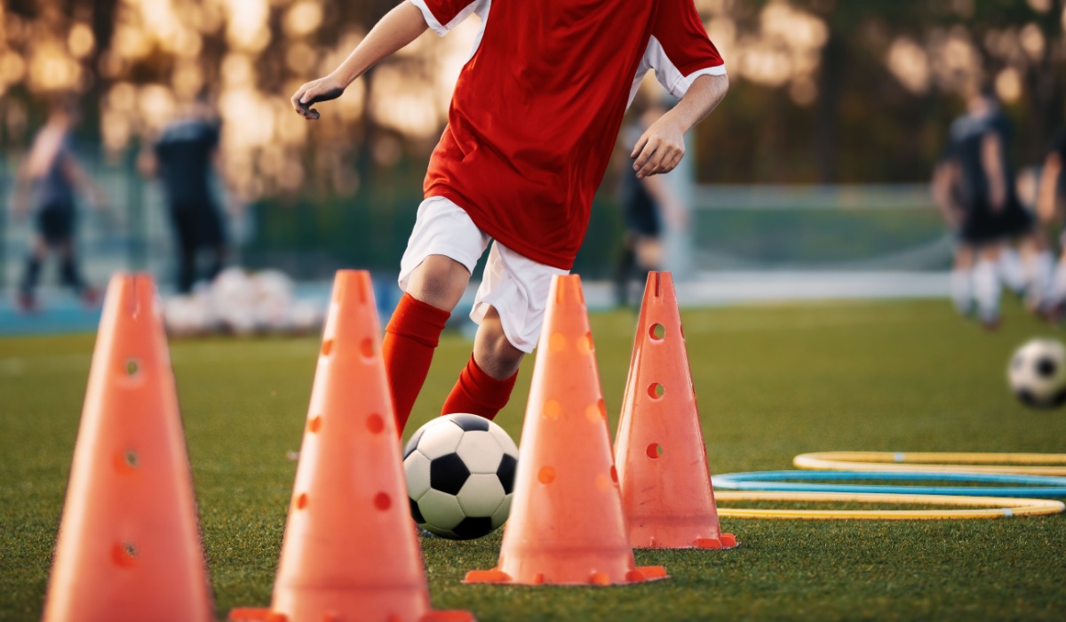 Young boy playing football