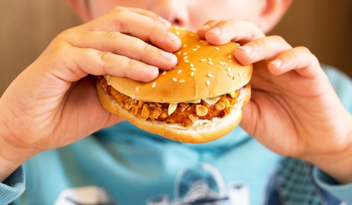 Boy eating burger