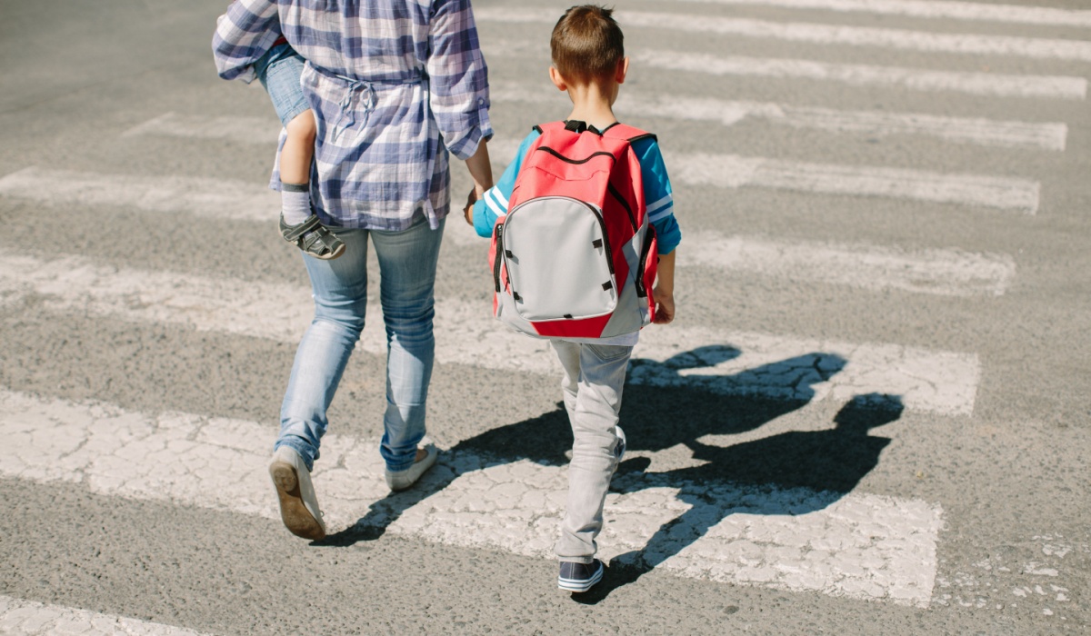 Mother walking with kids