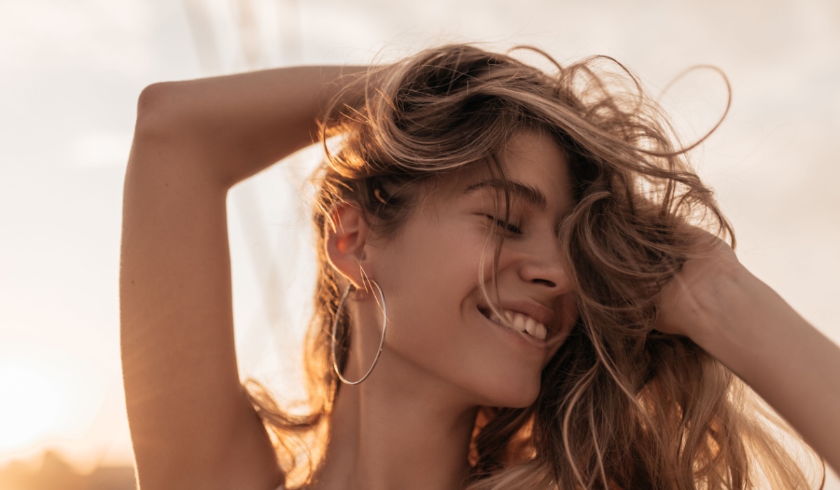 Bronzed woman in sunset