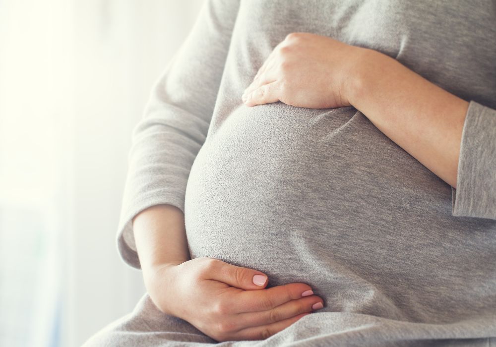 Pregnant woman holding baby bump