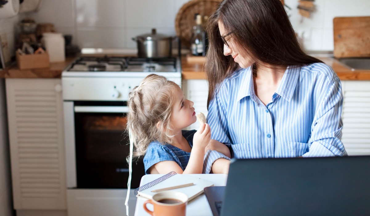Mother working from home with baby