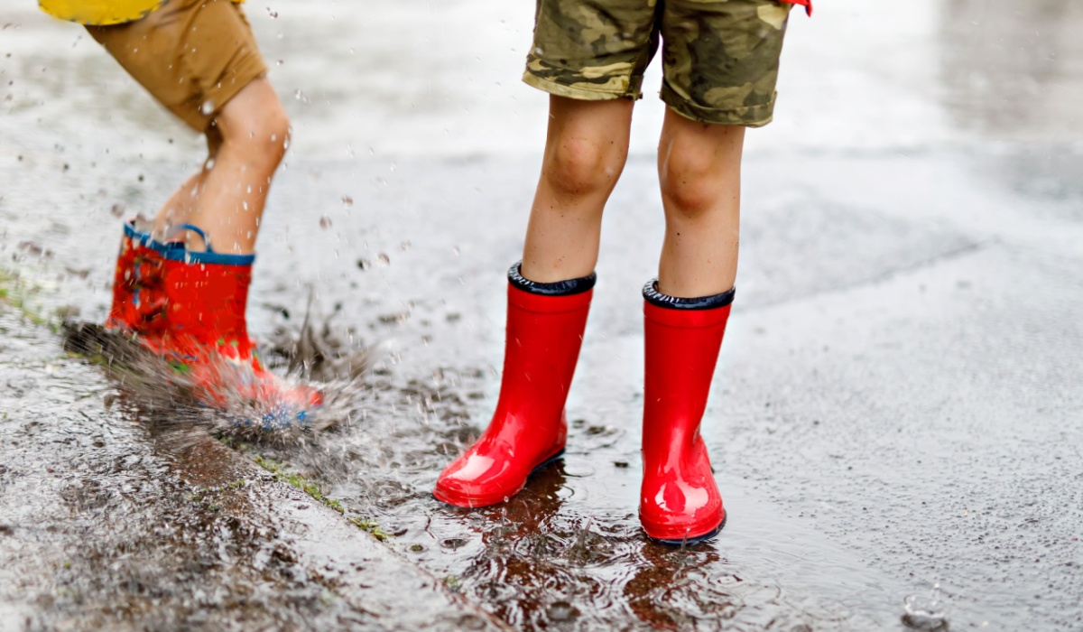 Boys playing in the rain