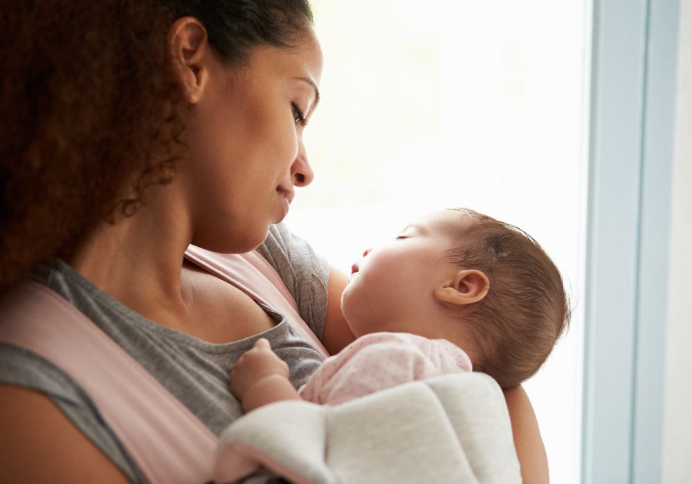 Woman holding newborn baby
